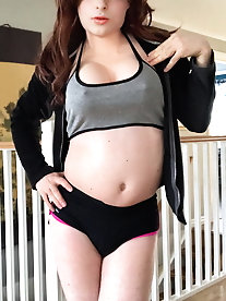 Smiling tranny strumpet is posing nude indoor