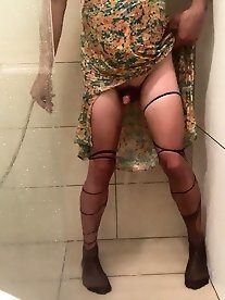 A trans woman with large breasts is pleasuring herself anally