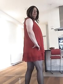 The seductive transgendered individual, Kellycd2022, flaunts her allure in leopard print attire and hosiery.