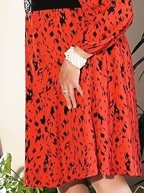 Valisere46 wears a sexy dress in this set of photos.