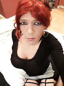 Ladyboy whore is posing at home