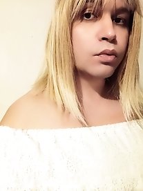 Alana as a femboy schoolgirl in a series of explicit photos.