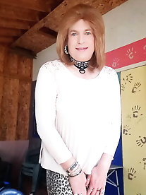 Tattooed shemale prostitute is taking off her panties for cash